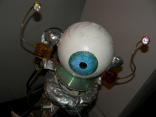 Illustration for article titled Shot-Glass Printing Bot, Darko-Like Rabbit, Molten Beer Bong Turn Up at Roboexotica "Cocktail Robotics" Convention